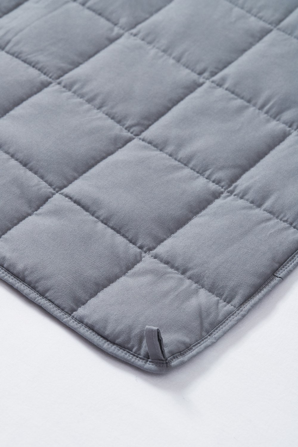 Close-up of the quilted pockets of the gray Cool Bamboo weighted blanket