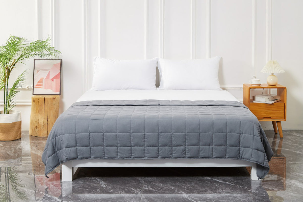 Gray Cool Bamboo weighted blanket on a bed